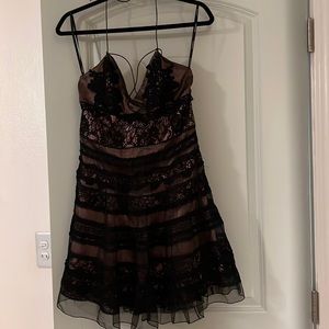 Unique dress absolutely gorgeous black lace over rose gold dress.